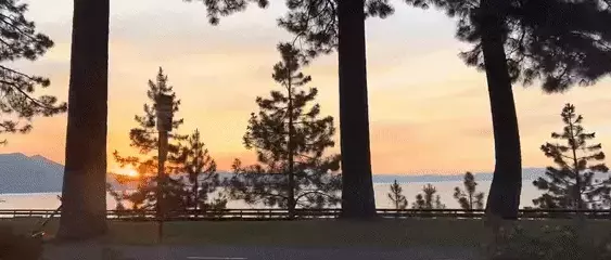 Road along the lake at the Nevada border at sunset